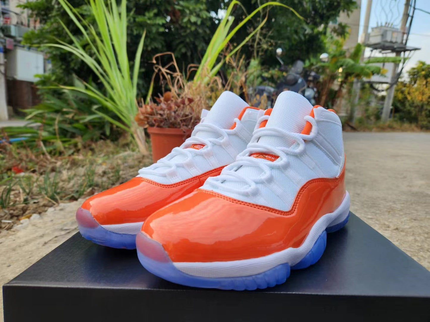 JORDAN 11 Orange And - White Unisex Streetwear Limited Edition - The Air Jordan 11 in White, Orange, and Red is a striking addition to the