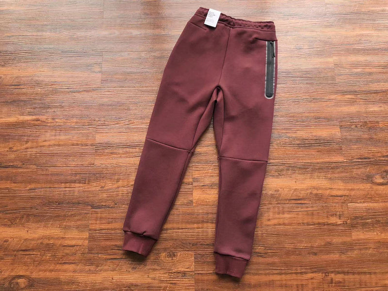NIKE Tech Fleece Pants - Berry - Pomegranate - Red Unisex Streetwear Limited Edition - The NIKE TECH FLEECE PANTS BERRY/POMEGRANATE - REPLICA combine modern athletic performance with a bold,