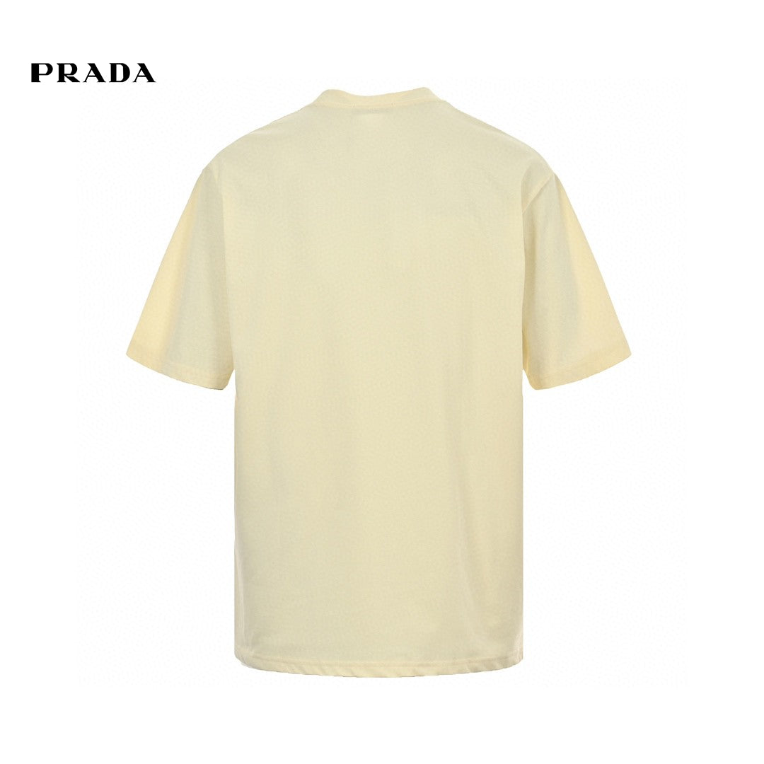 Prada T-shirt - With Bold Branding - Cream Unisex Streetwear Limited Edition - <span>This Prada t-shirt features a cream base with bold 'PRADA MILANO' branding across the chest.