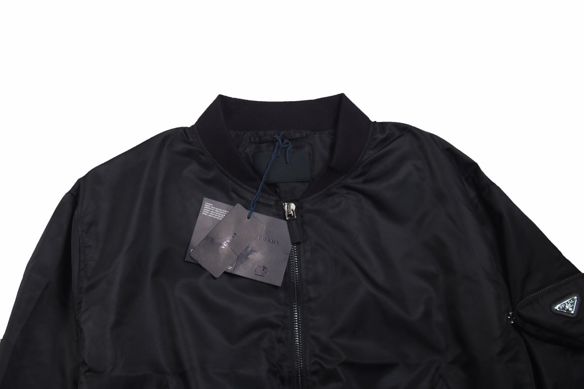Prada Bomber Jacket - Black Unisex Streetwear Limited Edition - This Prada jacket features a classic black bomber design with a zip-up front. It has