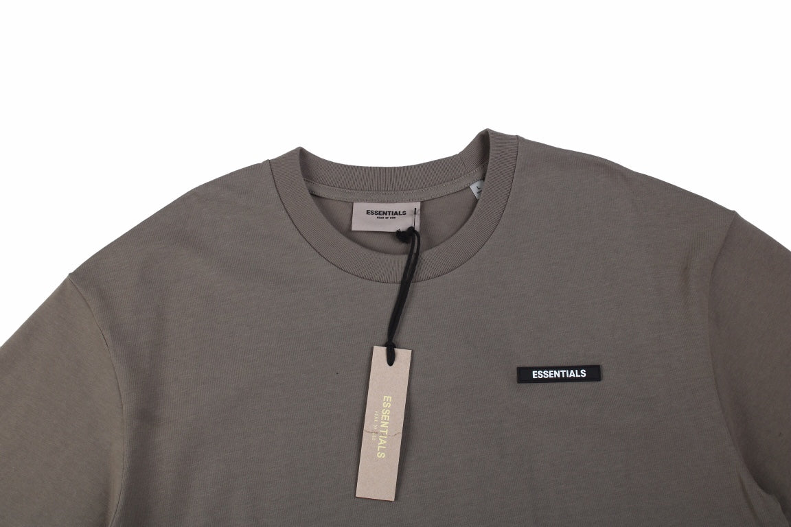 Fear Of God Essentials Logo T-shirt - Taupe - White Unisex Streetwear Limited Edition - This taupe-colored t-shirt from Fear of God Essentials features the same discreetly styled logo as