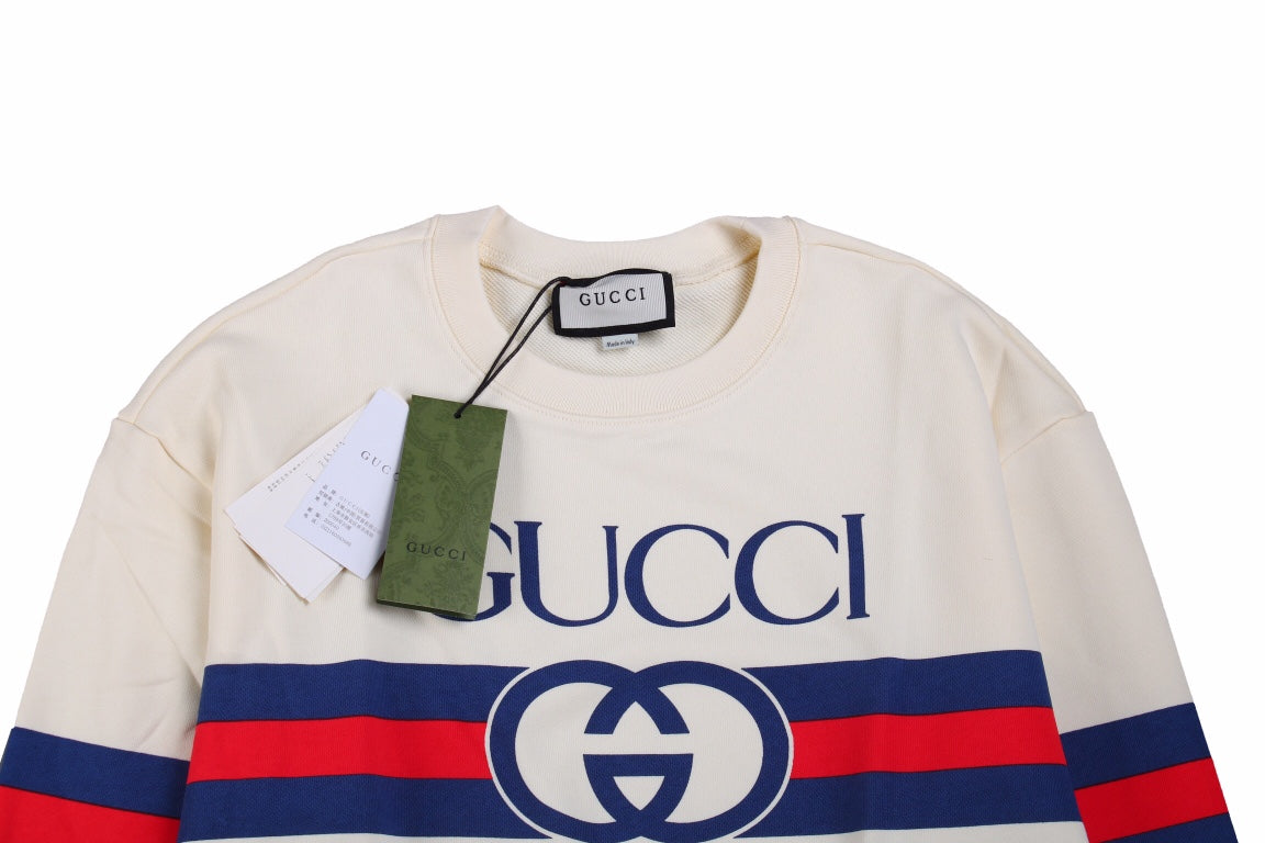 Gucci Sweatshirt - Red Unisex Streetwear Limited Edition - Cream sweatshirt with bold GUCCI logo. Blue and red stripe detailing across chest and sleeves.