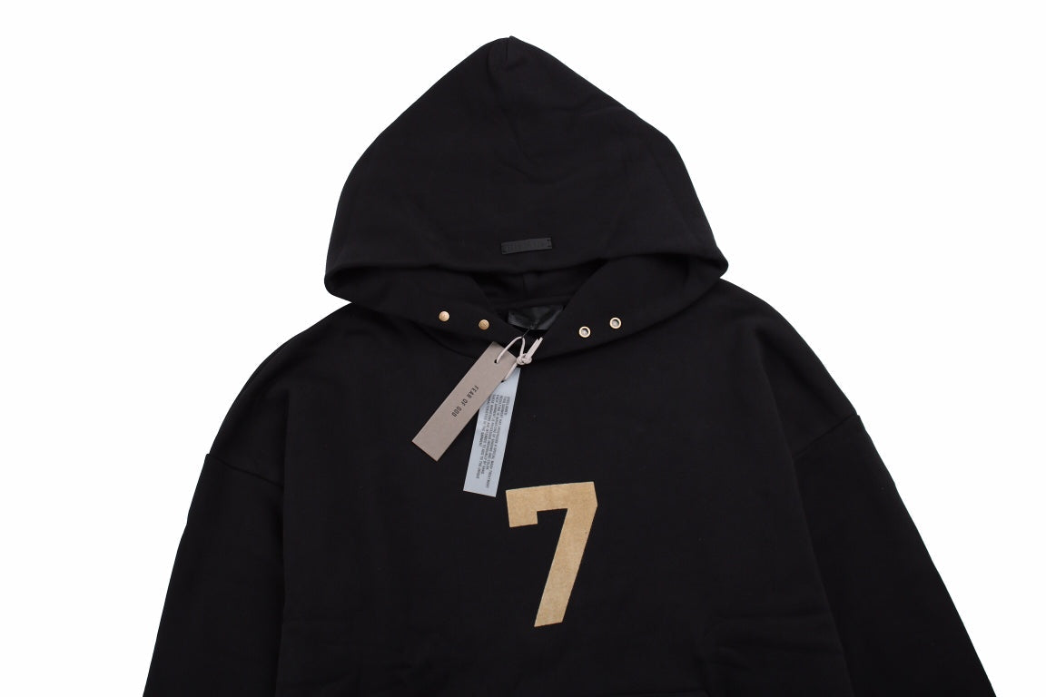 Fear Of God Hoodie - Black Unisex Streetwear Limited Edition - Black hoodie with tan '7' print on the chest. Comfortable and cozy fit. Features a