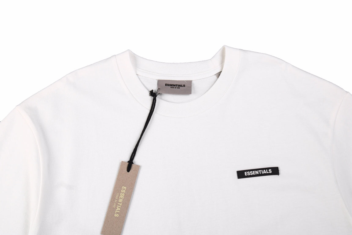 Fear Of God Essentials Logo T-shirt - White Unisex Streetwear Limited Edition - This minimalist white t-shirt from Fear of God Essentials features the brand s understated logo on