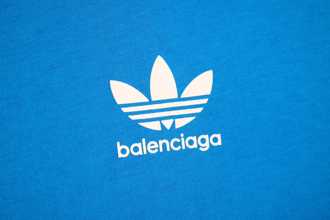 Balenciaga T-shirt With Adidas Collaboration - Blue Unisex Streetwear Limited Edition - <p dir='ltr'><span>Blue t-shirt featuring the iconic Adidas three stripes on the shoulders and a