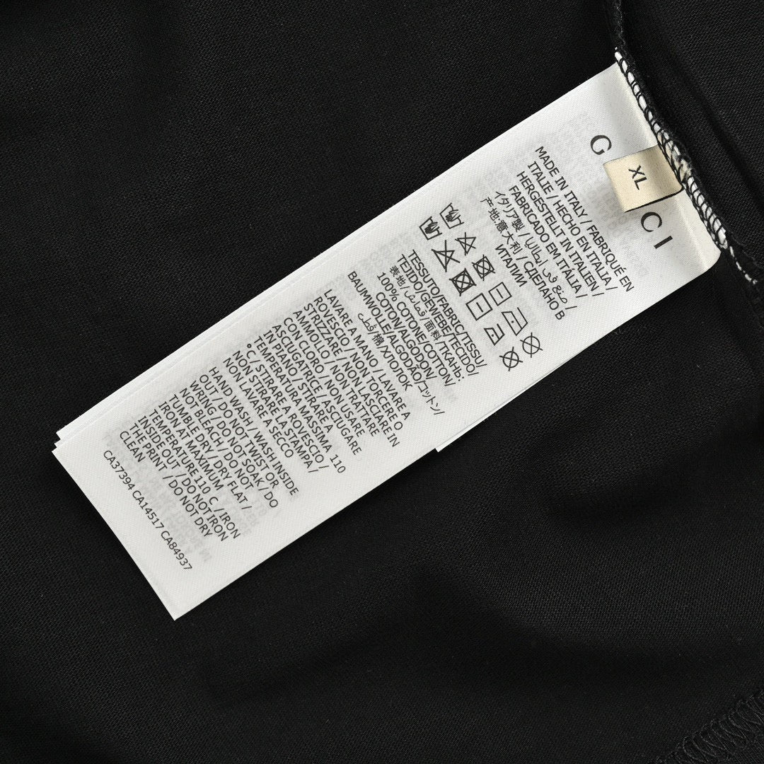 Gucci Triangle Logo T-shirt - Black Unisex Streetwear Limited Edition - This Gucci t-shirt features a subtle triangle logo on the chest. The shirt is primarily