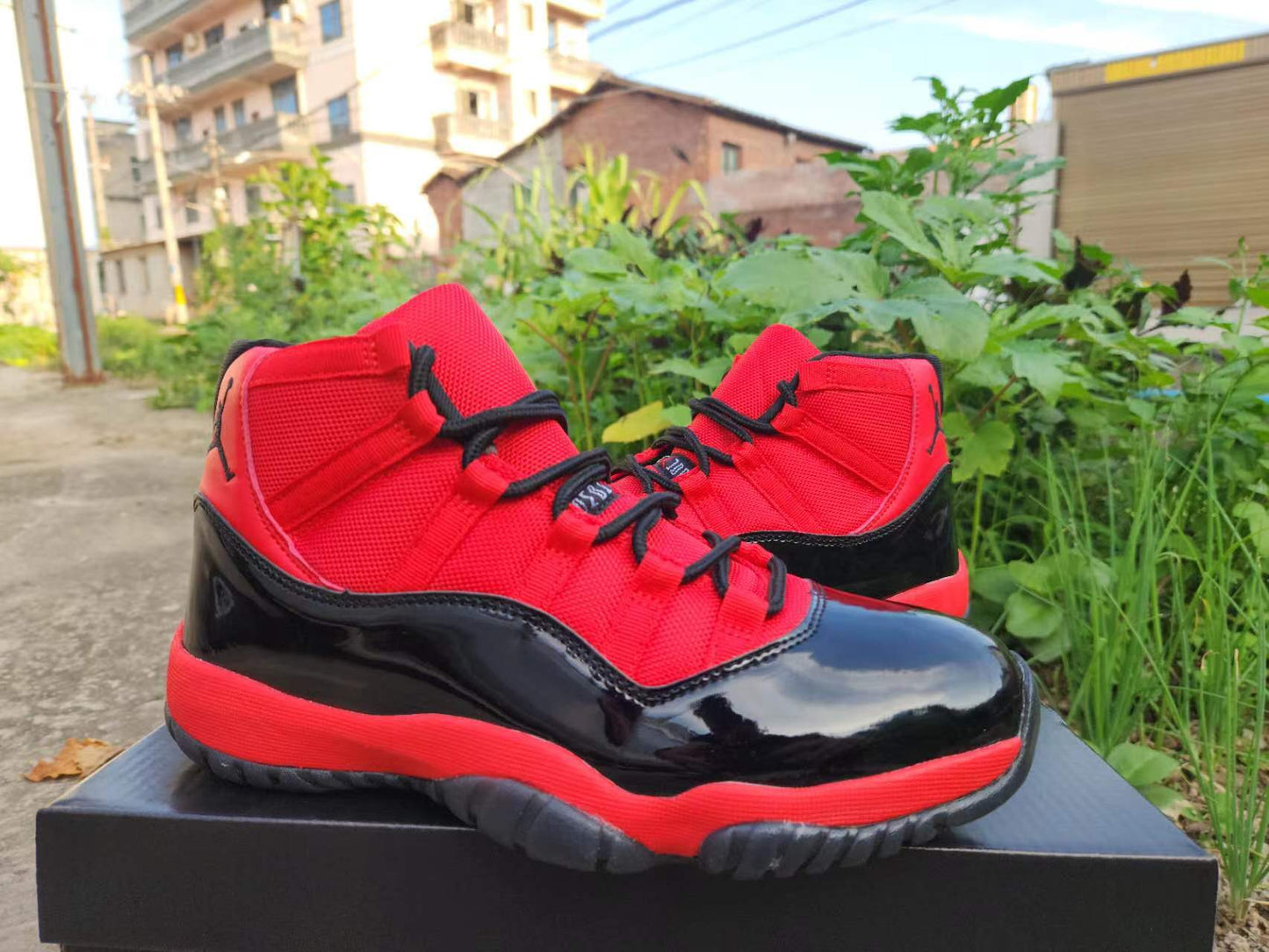JORDAN 11 And Red - Black Unisex Streetwear Limited Edition - The Air Jordan 11 showcased here is a vibrant and energetic take on the classic