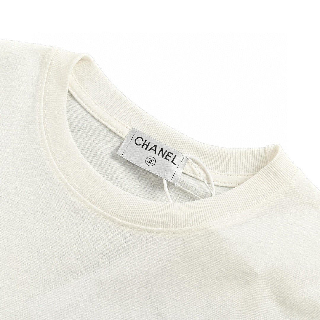 Chanel T-shirt - White Unisex Streetwear Limited Edition - This Chanel t-shirt features a minimalist white design. It has a subtle graphic on the