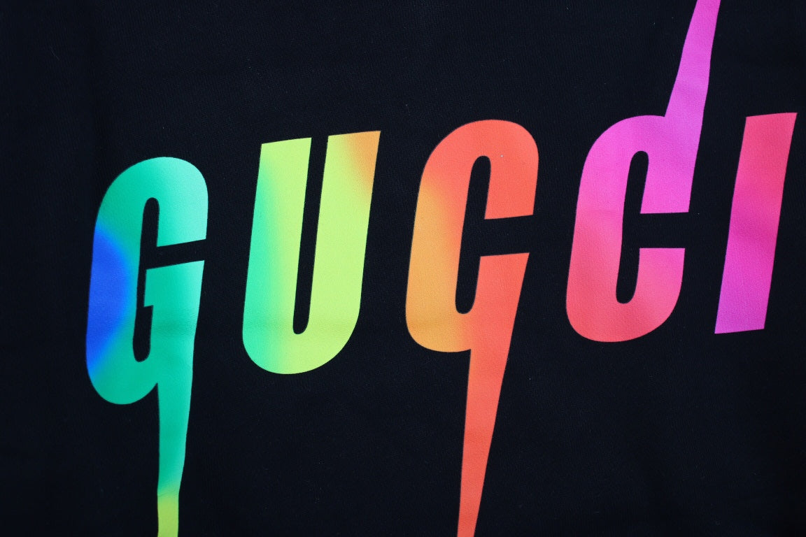 Gucci Rainbow Logo Hoodie - Black Unisex Streetwear Limited Edition - This black Gucci hoodie features a vibrant rainbow-colored 'GUCCI' logo on the front. It includes