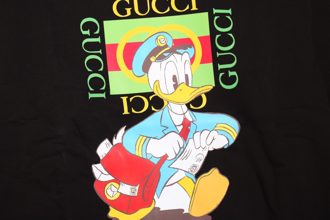 Gucci Donald Duck Sweatshirt - - Black Unisex Streetwear Limited Edition - This black Gucci sweatshirt features a vibrant graphic of Donald Duck along with the iconic