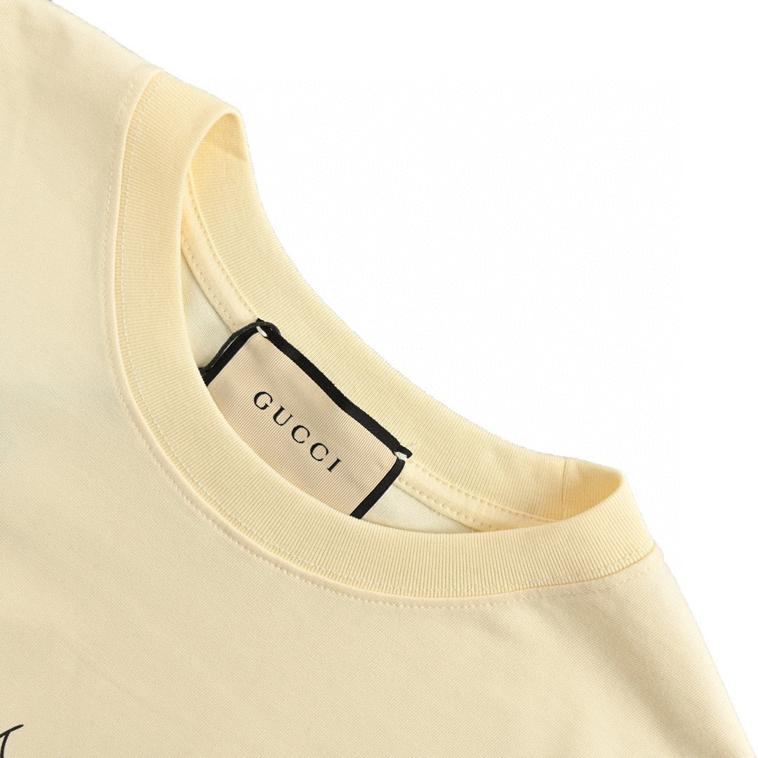 Gucci Cartoon Cow Logo T-shirt (cream) Unisex Streetwear Limited Edition - The Gucci Cartoon Cow Logo T-Shirt in cream is a fun and playful piece that