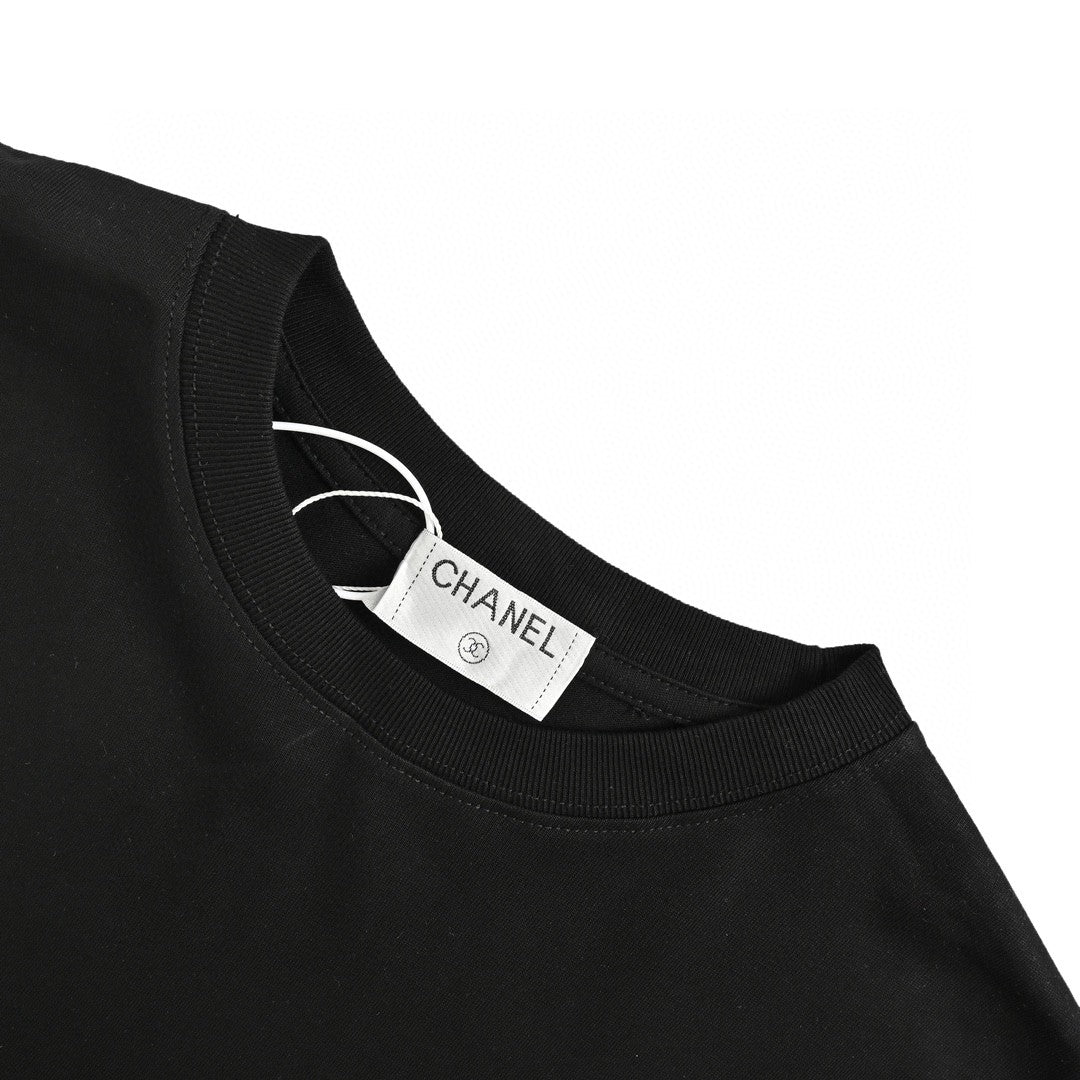Chanel Pink Splash Logo T-shirt - Black Unisex Streetwear Limited Edition - This Chanel t-shirt features a large pink logo with a splash paint effect, complemented by
