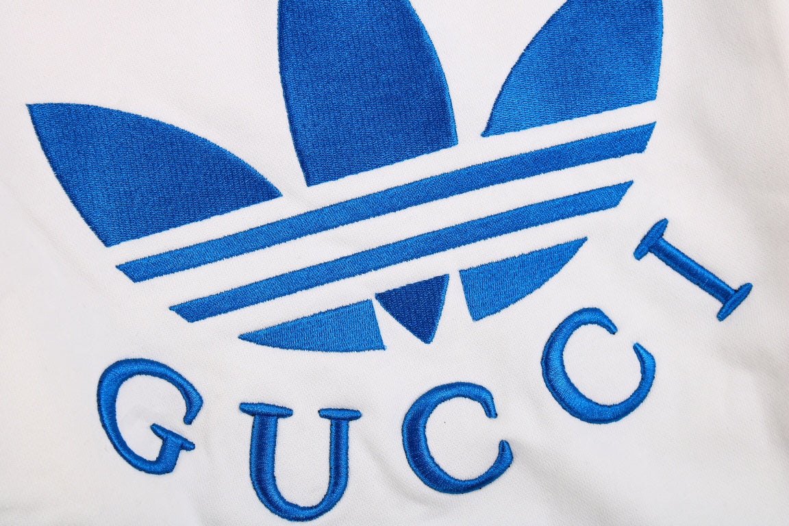 Gucci - Adidas Hoodie - White Unisex Streetwear Limited Edition - This Gucci x Adidas hoodie is crafted in white fabric, featuring the iconic blue Adidas
