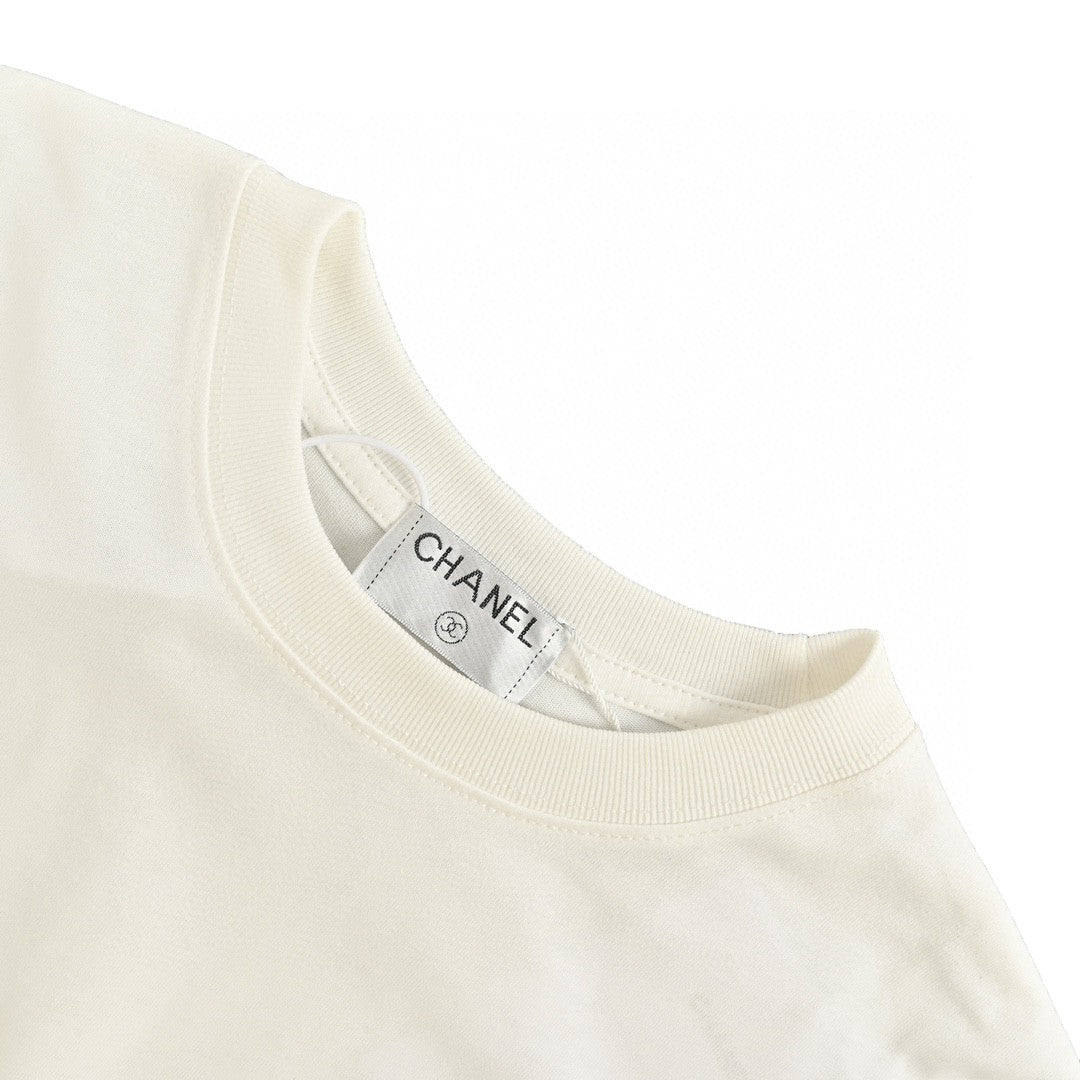 Chanel Splash Logo T-shirt - Pink Unisex Streetwear Limited Edition - This Chanel t-shirt features a large pink logo with a splash paint effect, complemented by