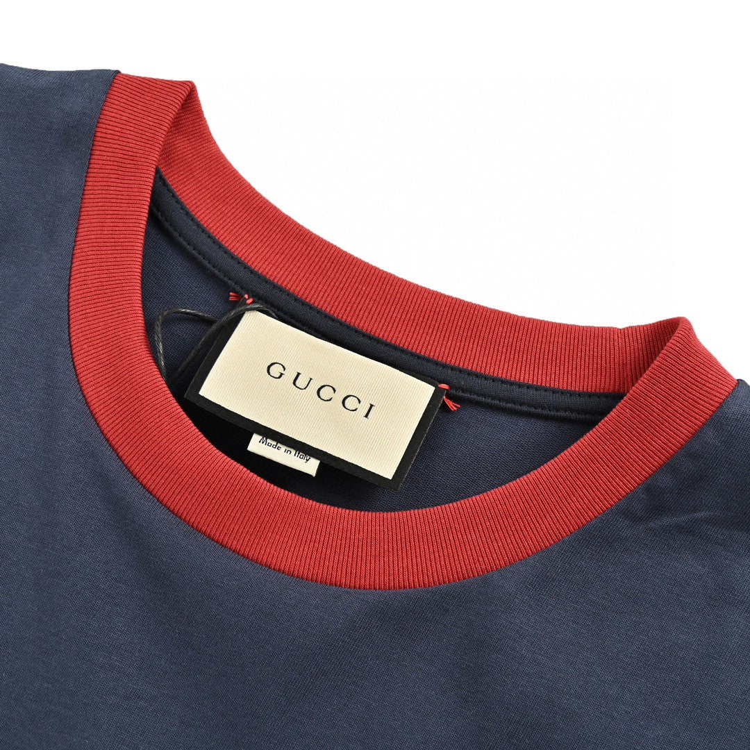 Gucci Cherry Logo T-shirt - Navy Unisex Streetwear Limited Edition - This Gucci t-shirt in navy features a small, playful cherry graphic intertwined with the iconic