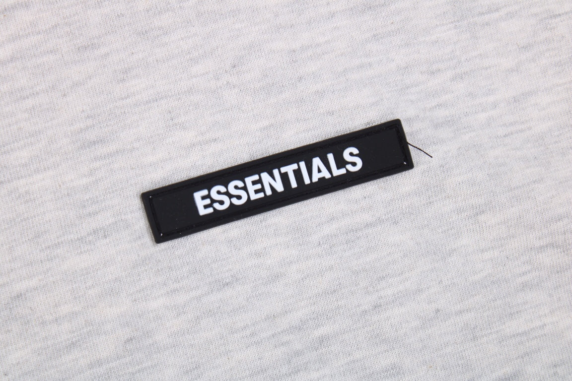 Fear Of God Essentials Logo T-shirt - Heather - Grey Unisex Streetwear Limited Edition - This heather grey t-shirt from Fear of God Essentials showcases a soft, versatile color with