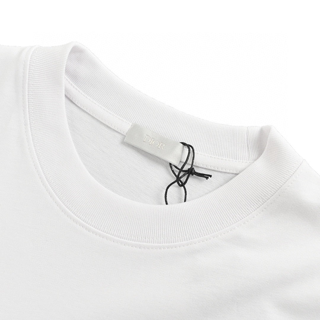 Dior Graffiti Logo T-shirt In - White Unisex Streetwear Limited Edition - The Dior Graffiti Logo T-Shirt in white is a contemporary piece that fuses streetwear aesthetics