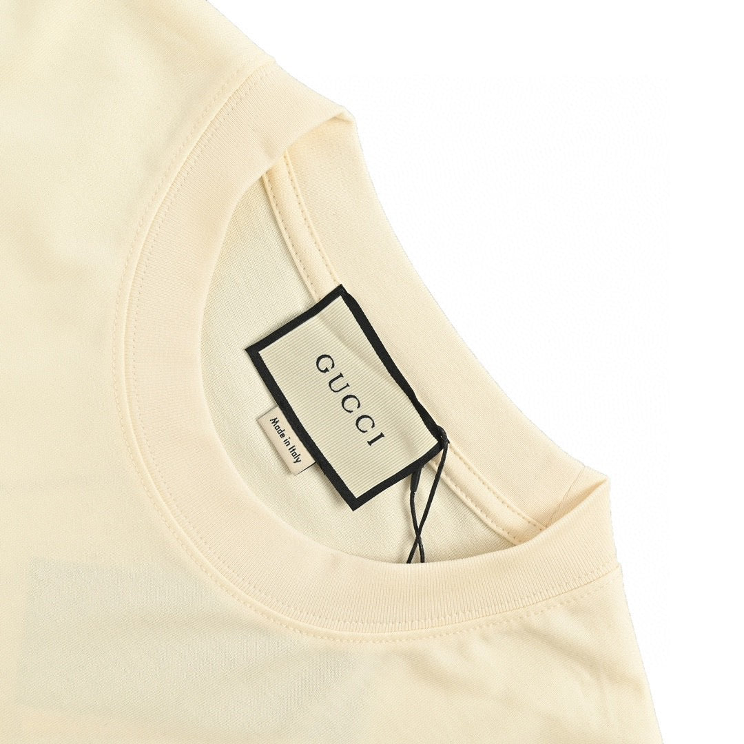 Gucci Triangle Logo T-shirt - Beige Unisex Streetwear Limited Edition - This Gucci t-shirt features a subtle triangle logo on the chest. The shirt is primarily