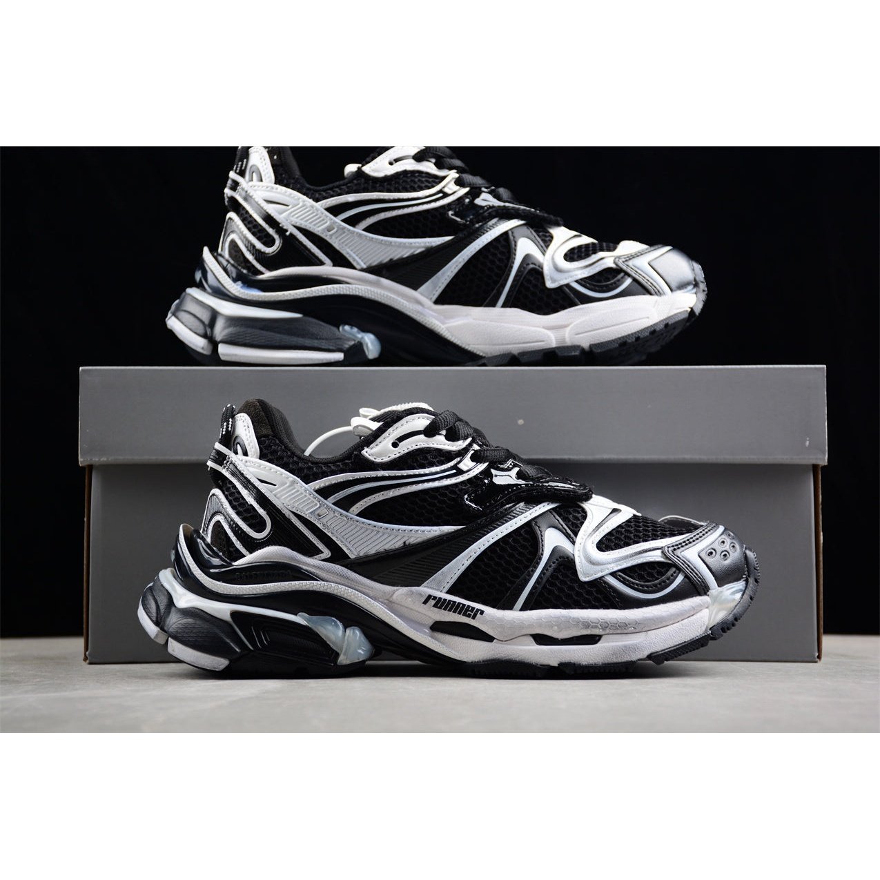 BALENCIAGA Runner - White Sneakers - Black Unisex Streetwear Limited Edition - The BALENCIAGA Runner x Black White sneakers exude a sleek and timeless elegance, perfect for