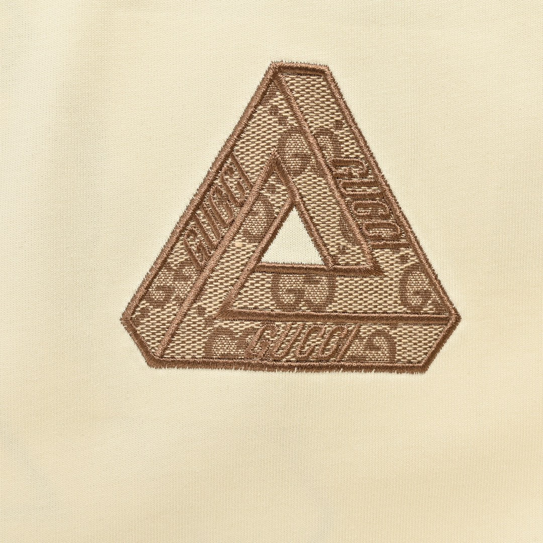 Gucci Triangle Logo T-shirt - Beige Unisex Streetwear Limited Edition - This Gucci t-shirt features a subtle triangle logo on the chest. The shirt is primarily