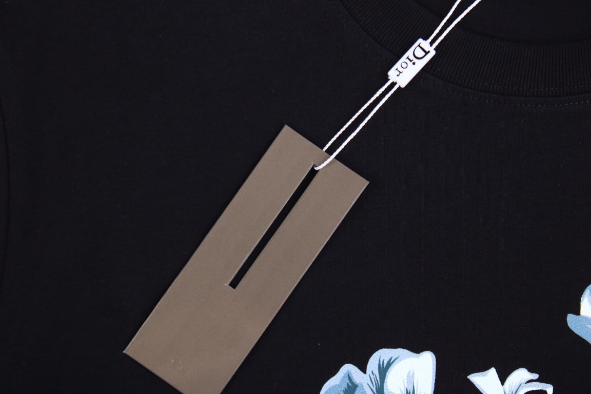 Dior T-shirt With Floral Graphic Design - Black Unisex Streetwear Limited Edition - <p dir='ltr'><span>This Dior t-shirt features a floral graphic design with text elements. It is