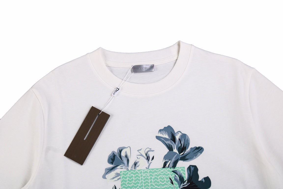 Dior T-shirt With Floral Graphic Design - White Unisex Streetwear Limited Edition - <p dir='ltr'><span>This Dior t-shirt features a floral graphic design with text elements. It is