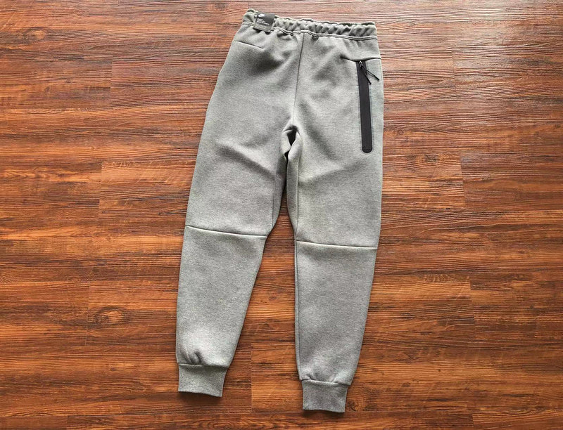 NIKE Tech Fleece Pants - Wolf - Grey Unisex Streetwear Limited Edition - The NIKE TECH FLEECE PANTS WOLF GREY - REPLICA blend modern athletic performance with sleek