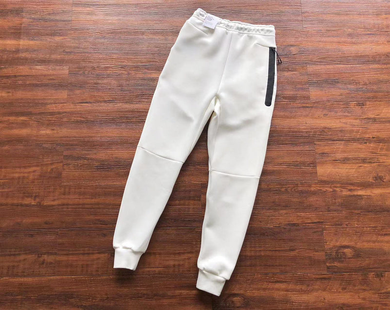 NIKE Tech Fleece Pants - - White Unisex Streetwear Limited Edition - The NIKE TECH FLEECE PANTS WHITE - REPLICA bring together modern athletic performance and sleek
