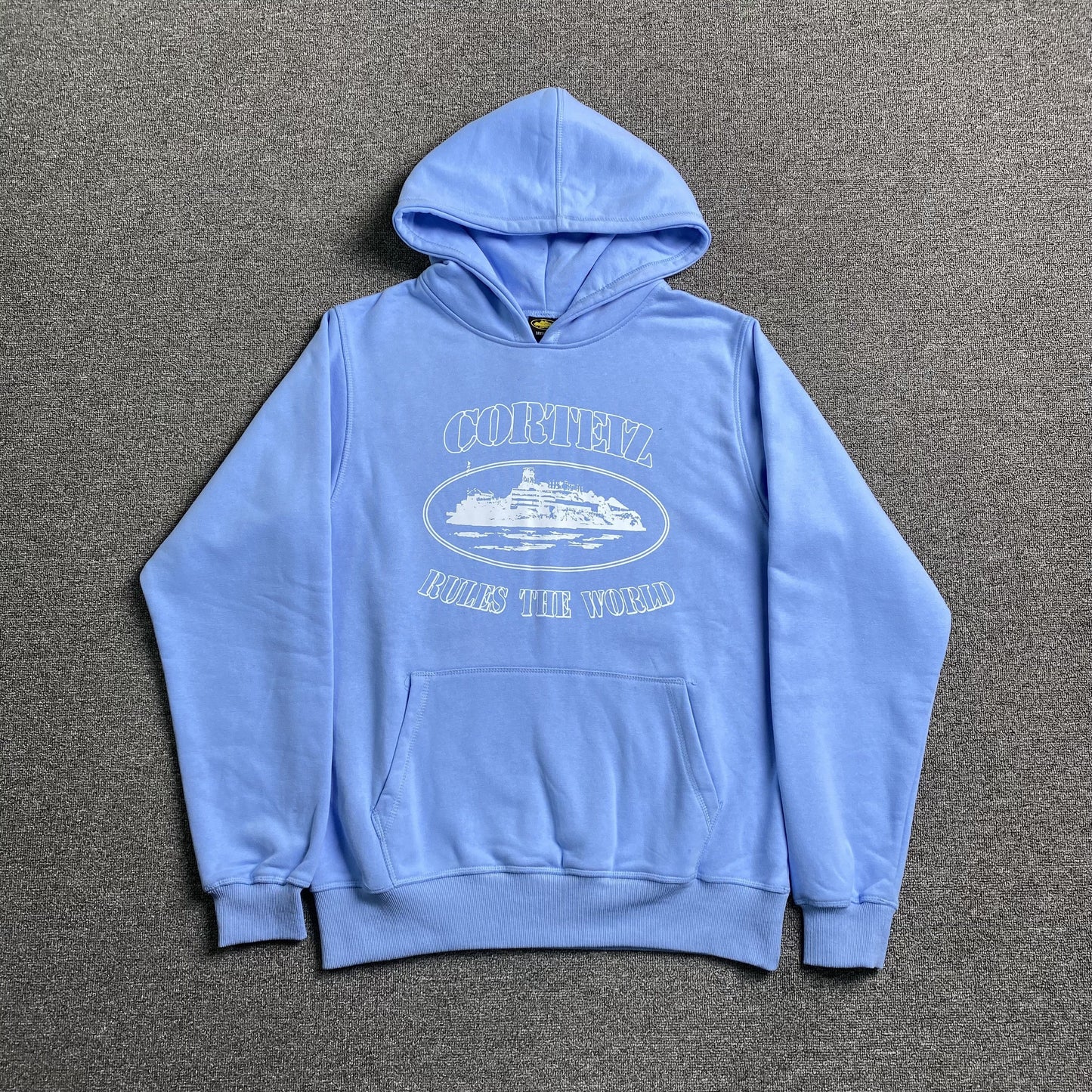 CORTEIZ Alcatraz Hoodie Baby Blu - Blue Unisex Streetwear Limited Edition - The CORTEIZ ALCATRAZ HOODIE BABY BLUE - REPLICA blends bold streetwear energy with a fresh,