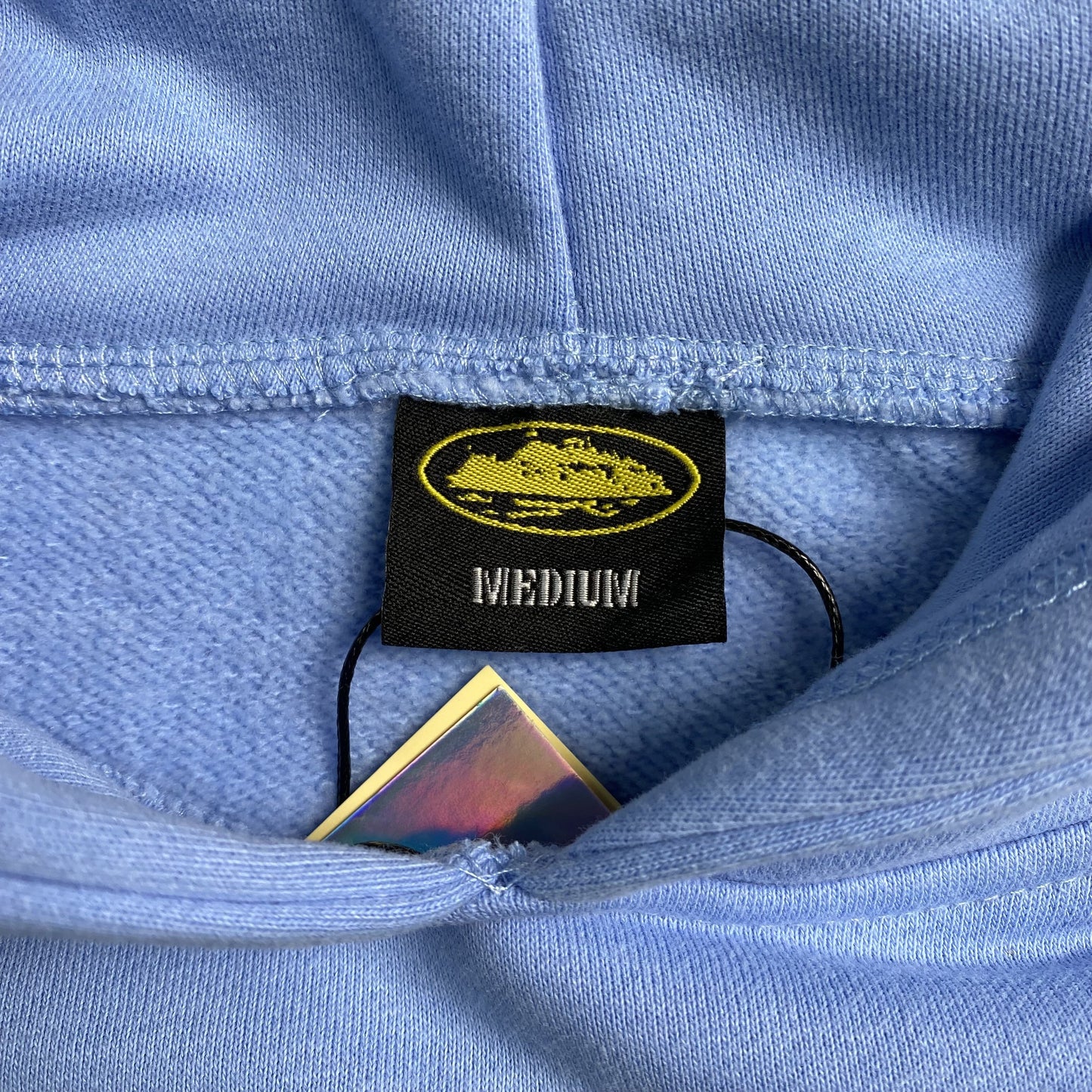 CORTEIZ Alcatraz Hoodie Baby Blu - Blue Unisex Streetwear Limited Edition - The CORTEIZ ALCATRAZ HOODIE BABY BLUE - REPLICA blends bold streetwear energy with a fresh,