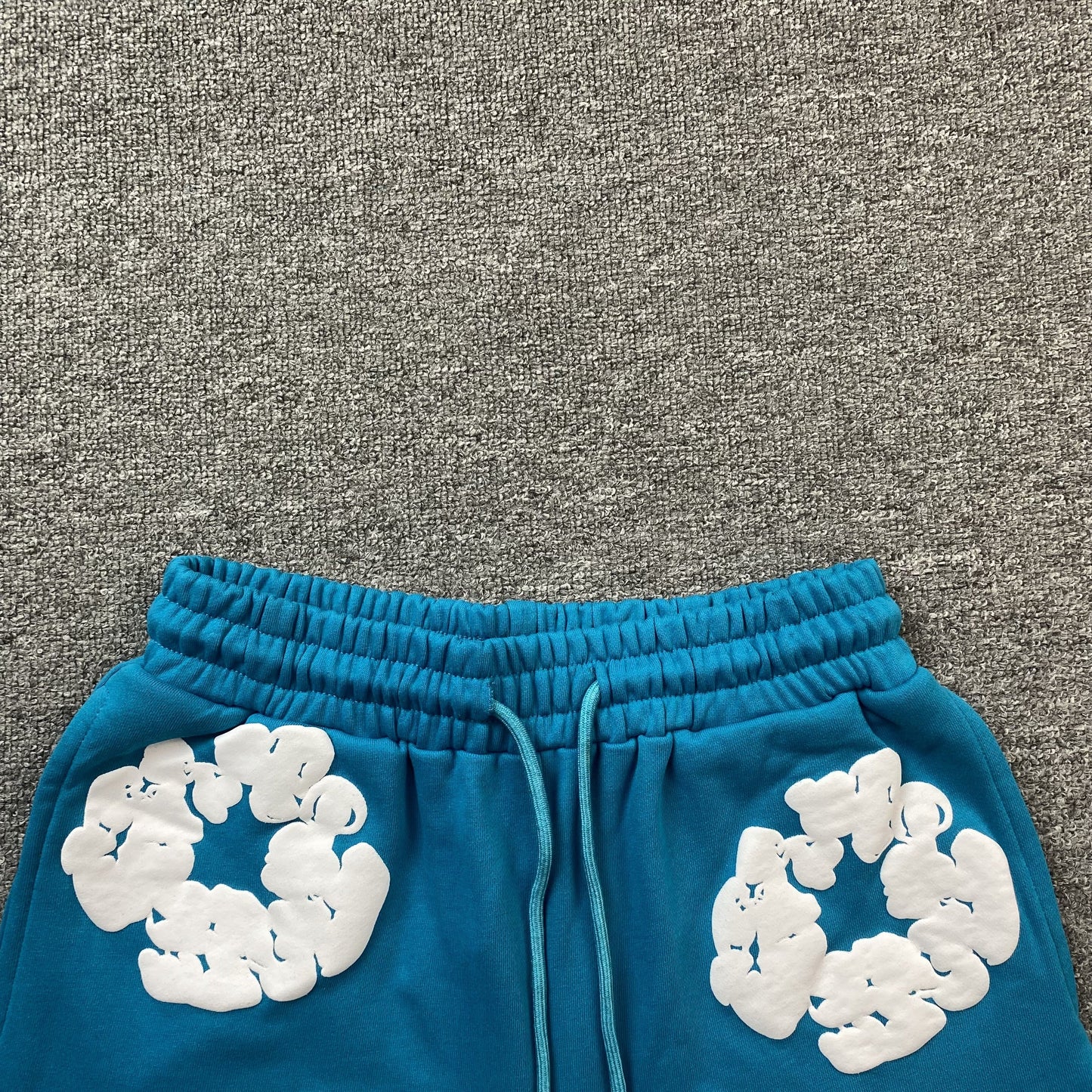 DENIM Tears Cotton Wreath Shorts Cerulean - Blue Unisex Streetwear Limited Edition - The DENIM TEARS COTTON WREATH SHORTS CERULEAN - REPLICA combine bold cultural symbolism with a