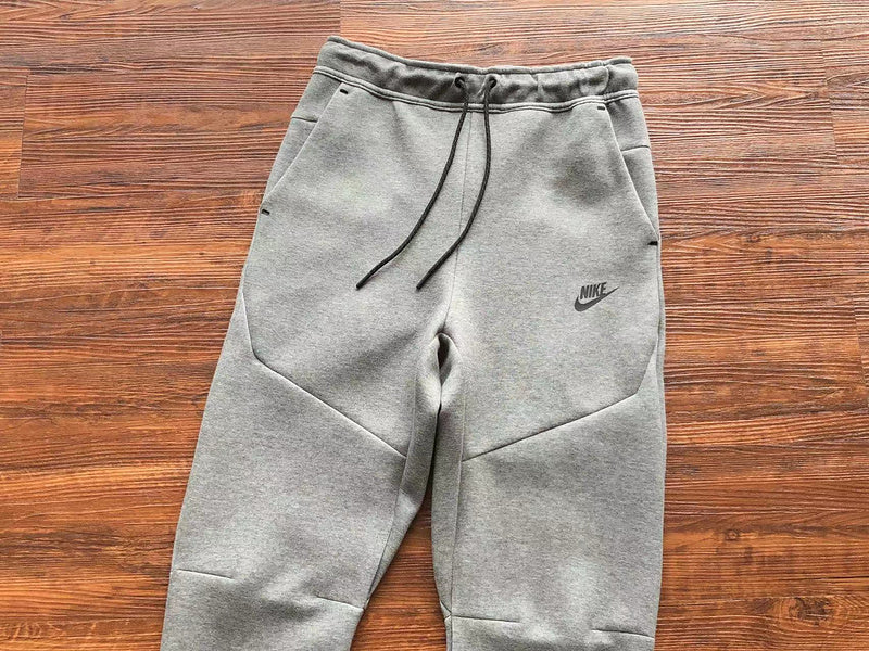 NIKE Tech Fleece Pants - Wolf - Grey Unisex Streetwear Limited Edition - The NIKE TECH FLEECE PANTS WOLF GREY - REPLICA blend modern athletic performance with sleek