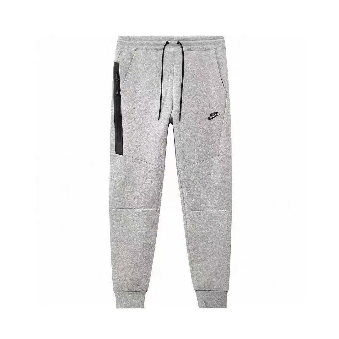 NIKE Tech Fleece Pants - Grey - - White Unisex Streetwear Limited Edition - The NIKE TECH FLEECE PANTS GREY/WHITE - REPLICA deliver the perfect combination of modern athletic