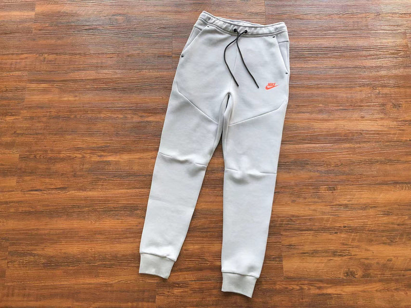 NIKE Tech Fleece Pants - Wolf Grey - Aquamarine - - Orange Unisex Streetwear Limited Edition - The NIKE TECH FLEECE PANTS WOLF GREY/AQUAMARINE/ORANGE - REPLICA offer a modern fusion of performance,