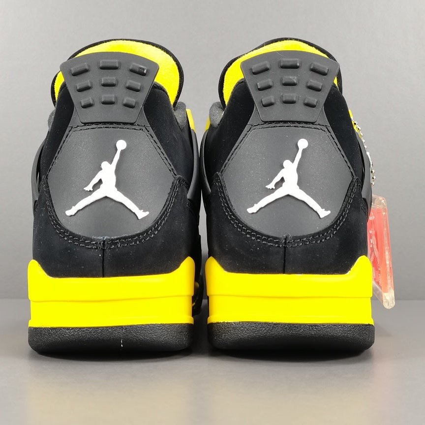 JORDAN 4 - Thunder Sneakers - Black Unisex Streetwear Limited Edition - Introducing the iconic Jordan 4 Thunder, a legendary sneaker that embodies the spirit of greatness