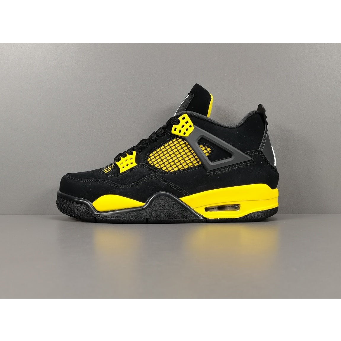 JORDAN 4 - Thunder Sneakers - Black Unisex Streetwear Limited Edition - Introducing the iconic Jordan 4 Thunder, a legendary sneaker that embodies the spirit of greatness
