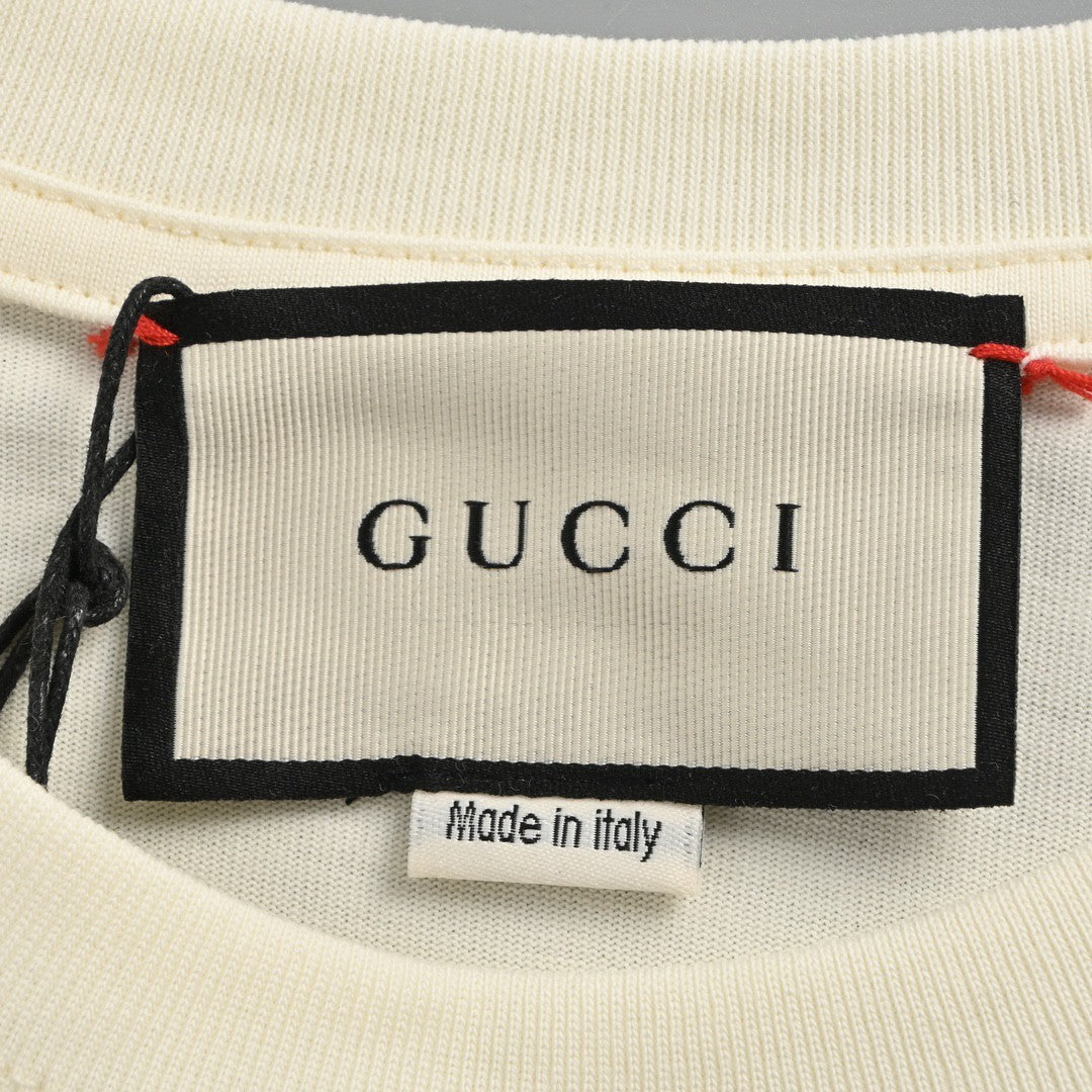 Gucci T-shirt With Heart Graphic - Cream Unisex Streetwear Limited Edition - <span>Playful and stylish. Features a red heart cartoon graphic. Green and red stripe design with