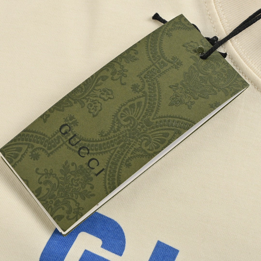 Camiseta Gucci color crema con estampado de oso