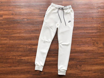 NIKE Tech Fleece Pants - - White Unisex Streetwear Limited Edition - The NIKE TECH FLEECE PANTS WHITE - REPLICA bring together modern athletic performance and sleek