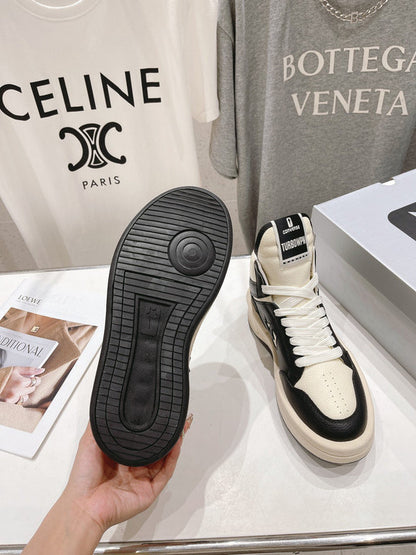 Rick Owens High-top Sneakers - Black Unisex Streetwear Limited Edition - **Rick Owens High-Top Sneakers: Dual-Tone Elegance and Craftsmanship** Step up your fashion game with Rick