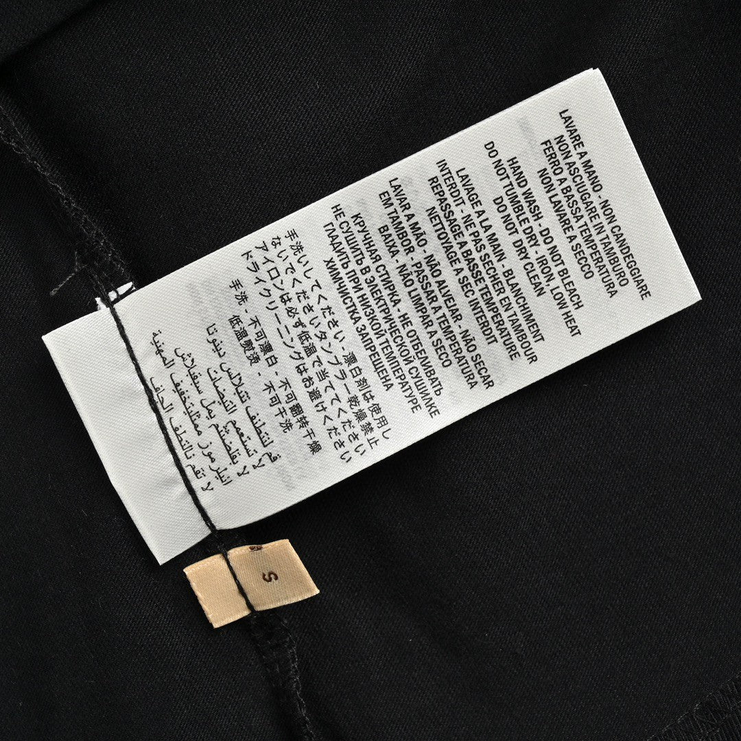 Camiseta Gucci con logo salpicado (negra)