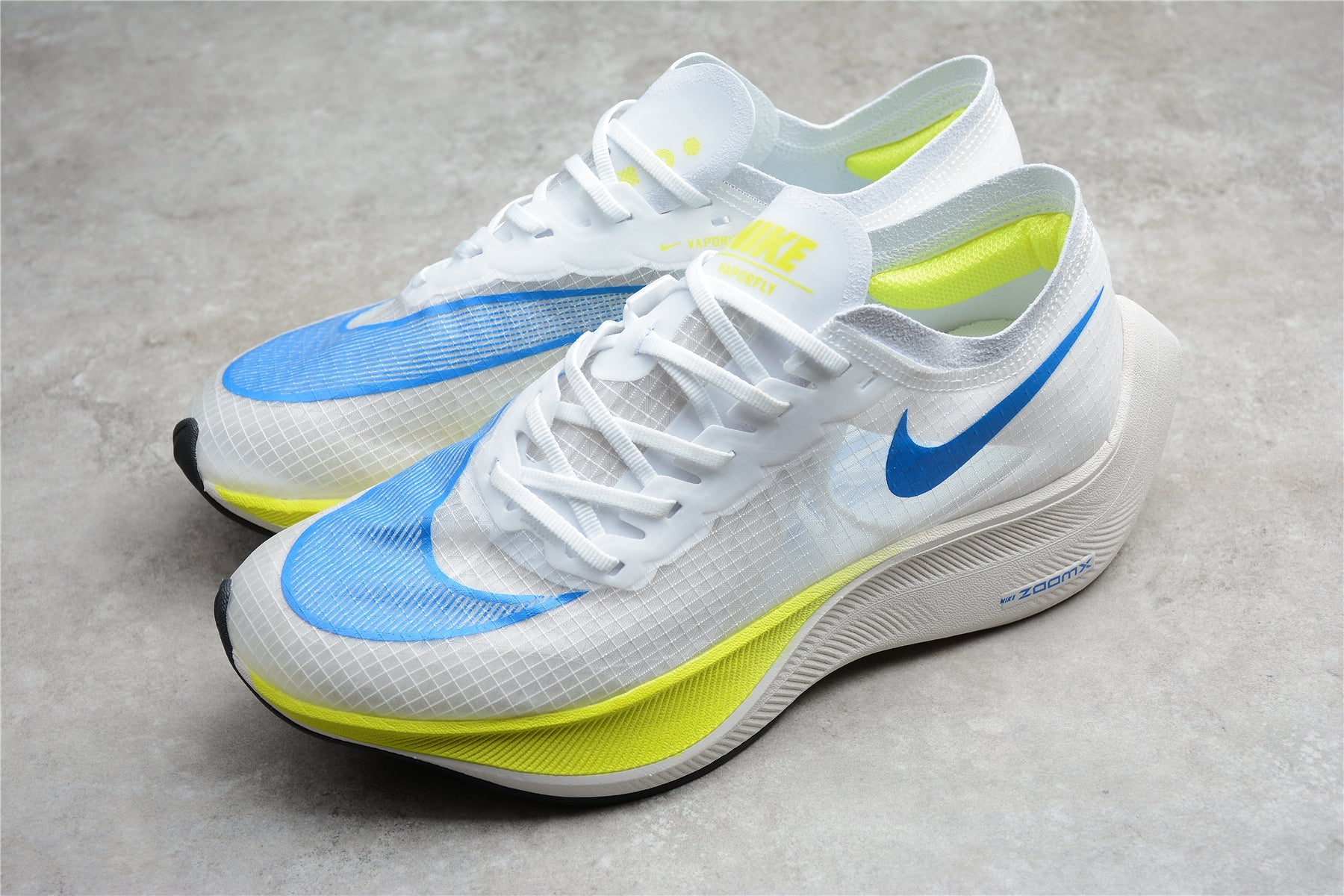 Zoom - Vaporfly Ne - T% 2 White blue And Yellow Unisex Streetwear Limited Edition - ### Nike ZoomX Vaporfly NEXT% 2 The Nike ZoomX Vaporfly NEXT% 2 is a top-of-the-line