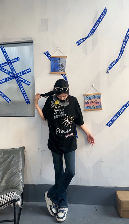 T-shirt noir Chanel "Les femmes sauveront le monde"