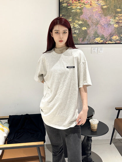 Camiseta con el logo de Fear of God Essentials - Gris jaspeado
