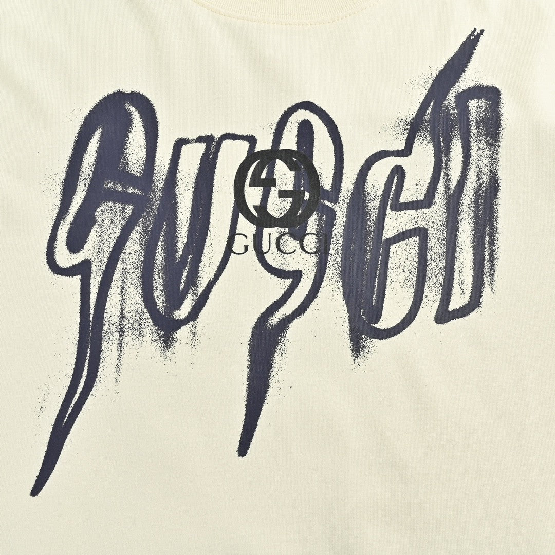 Gucci Graphic T-shirt - Cream Unisex Streetwear Limited Edition - <span>This Gucci t-shirt features a striking graphic design with the Gucci logo displayed in a