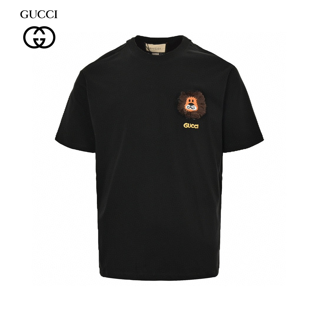 Gucci T-shirt - Black Unisex Streetwear Limited Edition - This Gucci t-shirt features a playful design with a small graphic of a cartoon face