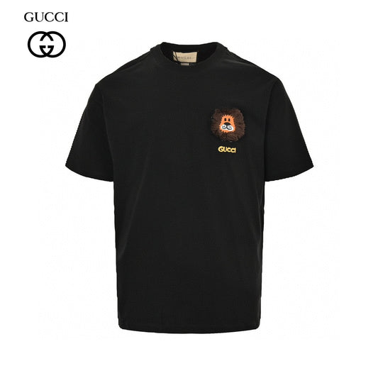 Gucci T-shirt - Black Unisex Streetwear Limited Edition - This Gucci t-shirt features a playful design with a small graphic of a cartoon face