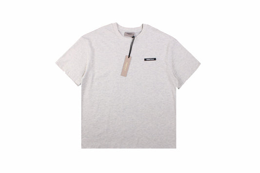 Fear Of God Essentials Logo T-shirt - Heather - Grey Unisex Streetwear Limited Edition - This heather grey t-shirt from Fear of God Essentials showcases a soft, versatile color with