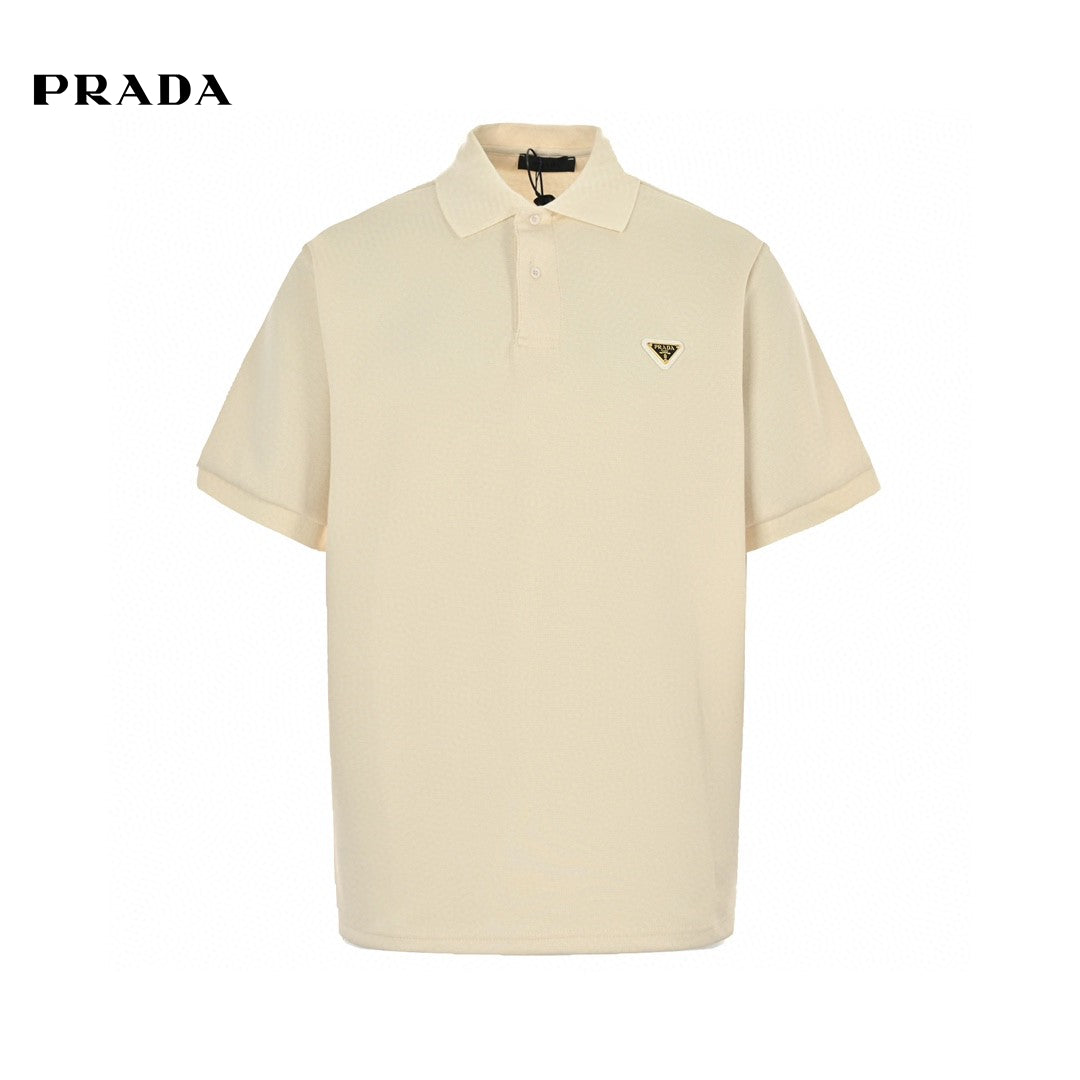Prada Polo Shirt - Cream Unisex Streetwear Limited Edition - This Prada polo shirt features a simple yet elegant cream design. The shirt is adorned