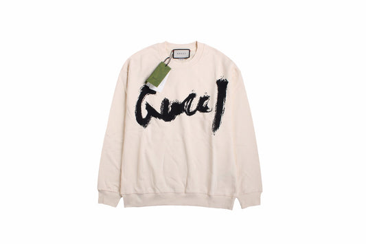 Gucci Sweatshirt - Black Unisex Streetwear Limited Edition - Cream-colored sweatshirt with a bold, brushstroke-style 'Gucci' logo in black. Features ribbed cuffs and hem